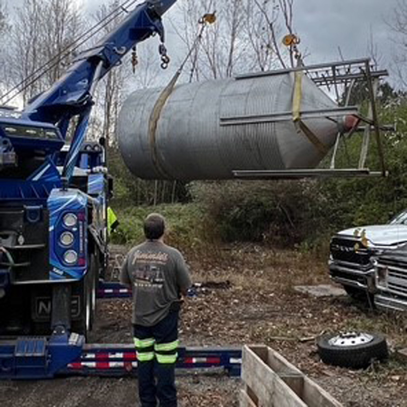 tow truck lifting heavy equipment