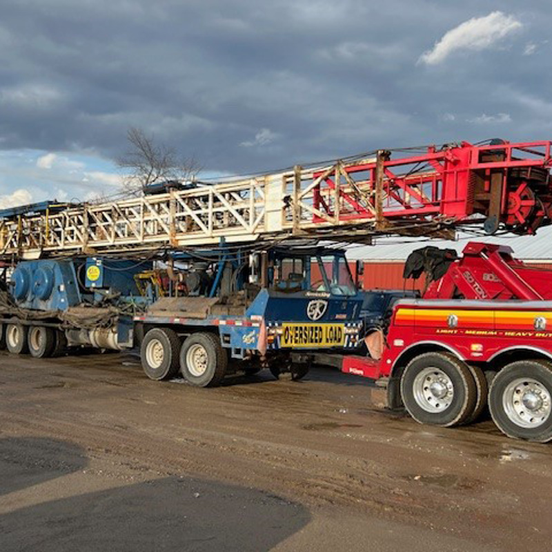 heavy duty towing truck towing a semi truck