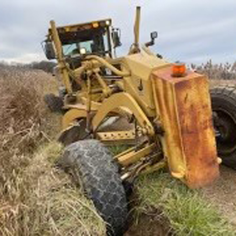 tractor that is stuck in a ditch